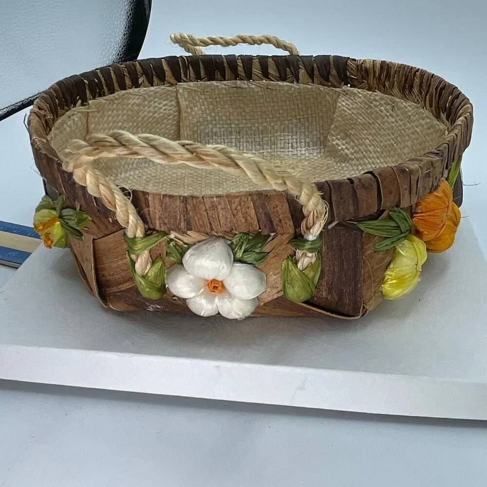 Vintage woven raffia basket with flowers and handles. Lined.